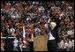 Nikki Giovanni, renown poet and Virginia Tech English professor, raises her arms in cheer after offering remarks Tuesday, April 17, 2007, during a Convocation honoring the victims of Monday's deadly shooting. "We are the Hokies! We will prevail! We will prevail! We are Virginia Tech!" Ms. Giovanni said, bringing the audience to its feet and into spontaneous cheer. White House photo by Eric Draper