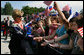 Mrs. Laura Bush is greeted by children waving flags as she and President George W. Bush arrive Tuesday, June 10, 2008, to attend the Lipizzaner Horse Exhibition at Brdo Castle in Kranj, Slovenia. White House photo by Shealah Craighead