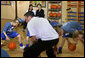 Mrs. Laura Bush watches a basketball demonstration at the Lough View Integrated Primary School's Gym in Belfast, Northern Ireland, June 16, 2008, during her visit to the school with President Bush. White House photo by Shealah Craighead