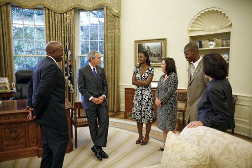 President George W. Bush meets with the Big Brother and Big Sister of the Year in the Oval Office Friday, July 28, 2006. From left, they are: Big Brother of the Year Sylvester Fulton of Memphis, Tenn.; LaMecca Butler, Betsy's little sister; Big Sister of the Year Betsy Gorman-Bernardi of Albany, N.Y.; Jeremy Moore, Sylvester's little brother; and President and CEO Judy Vredenburgh of BBBS of America. White House photo by Paul Morse