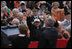 President George W. Bush and Mrs. Bush wave to a crowd at the American Cemetery in Margraten, Netherlands Sunday, May 8, 2005, honoring those who served in World War II 60 years ago.