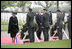 Queen Beatrix of The Netherlands and President George W. Bush pause in respect before wreaths at the Netherlands American Cemetery Sunday, May 8, 2005, in Margraten, honoring those who served during World War II.