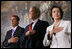 President George W. Bush stands with House Minority Leader John Boehner and Speaker of the House Nancy Pelosi for the playing of the National Anthem Thursday, March 29, 2007, during Congressional Gold Medal ceremonies honoring the Tuskegee Airmen. White House photo by Eric Draper