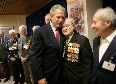 During a meeting with U.S. and Russian veterans, President George W. Bush hugs Russian veteran Vasik Ivanovich Korneer after he offered the President a coin from his service in Berlin during World War II in Moscow, Monday, May 9, 2005. President Bush asked that the veteran give the coin to a family member and thanked him for his courage.