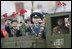 Veterans of Russia's military hold up flowers as they ride through Moscow's Red Square in a parade held to commemorate the 60th Anniversary of the end of World War II Monday, May 9, 2005.