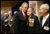 During a meeting with U.S. and Russian veterans, President George W. Bush hugs Russian veteran Vasik Ivanovich Korneer after he offered the President a coin from his service in Berlin during World War II in Moscow, Monday, May 9, 2005. President Bush asked that the veteran give the coin to a family member and thanked him for his courage.