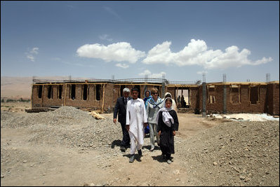 Mrs. Laura Bush is joined by Governor of Bamiran Province, Habiba Sarabi, right, and students, during a tour of the future site of the Ayenda Learning Center Sunday, June 8, 2008, in Bamiyan, Afghanistan.The tour was led by Ihsan Ullah Bayat, far left. Once completed, the Ayenda Learning Center will provide a safe and nurturing environment for 128 of Bamiyan most disadvantaged children to live. At the same time, it will provide educational opportunities for as many as 210 children in the region.