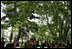 Under the boughs of the trees of Gul Khana Palace, Mrs. Laura Bush delivers remarks Sunday, June 8, 2008, during a press availability with President Hamid Karzai of Afghanistan in Kabul.