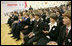 President George W. Bush and Mrs. Laura Bush applaud as they watch a skit sponsored by PEPFAR on HIV/AIDS performed by students at School 57 Tuesday, April 1, 2008, in Kyiv, Ukraine.