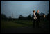 President George W. Bush, accompanied by Mrs. Laura Bush, talks to reporters before their departure to Ukraine Monday, March 31, 2008, on the South Lawn of the White House. President Bush urges Congress to pass the FISA reform bill and to act quickly to approve the Colombian Free Trade Agreement. President and Mrs. Laura Bush depart on a six-day trip to Ukraine, Romania, Croatia, and Russia. President Bush will have a scheduled meeting with Russian President Vladimir Putin.