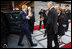 President George W. Bush reaches out for the hand of President Stjepan Mesic of Croatia upon arrival at the official welcoming ceremonies Friday, April 4, 2008, at the Office of the President in Zagreb.