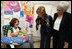 Mrs. Laura Bush and Mrs. Aliza Olmert, spouse of Israel's Prime Minister Ehud Olmert, greet a young mother in the Breast Feeding Education Room during a visit to the Tipat Chalav-Gonenim Neighborhood Mother and Child Care Center in Jerusalem Wednesday, May 14, 2008. There are 30 similar centers throughout the city providing prenatal, postnatal and preventative care and advice on breastfeeding, nutrition, immunizations and disease screening.