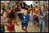 Mrs. Laura Bush looks on as second- and fifth-graders perform a Jewish and Arabic Dance at the Hand in Hand School for Jewish-Arab Education in Jerusalem. Founded in 1997, the Hand in Hand Center runs a network of four bilingual schools in Israel.