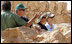 President George W. Bush and Mrs. Laura Bush stand with Mrs. Aliza Olmert, spouse of Israeli Prime Minister Ehud Olmert, as they listen to Eitan Campbell, Director of the Masada National Park, during a visit to the historic site Thursday, May 15, 2008, in Masada, Israel.