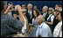 President George W. Bush and President Shimon Peres of Israel are surrounded by members of the media as they pose for photographs during their meeting Wednesday, May 14, 2008, at President Peres' Jerusalem residence.