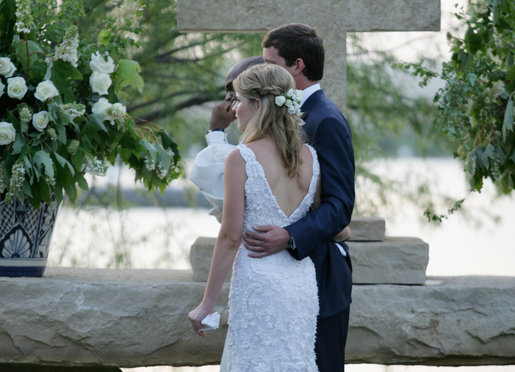 Jenna Bush and Henry Hager stand at the altar, listening to a reader, with the Reverend Kirbyjon Caldwell during their wedding ceremony Saturday, May 10, 2008, at Prairie Chapel Ranch near Crawford, Texas. White House photo by Shealah Craighead