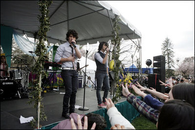 Excited Fans reach out toward the Jonas Brothers as they perform on the South Lawn of the White House Monday, March 24, 2008, during the 2008 White House Easter Egg Roll. 