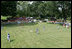 A view from the outfield on the South Lawn of the White House shows the opening game of the the 2008 Tee Ball season in action Monday, June 30, 2008, between the Cramer Hill Little league Red Sox of Camden, N.J., and the Jose M. Rodriguez Little League Angels of Manatí, Puerto Rico.