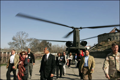 Laura Bush and U.S. Ambassador to Afghanistan Zalmay Khalilzad arrive at the Presidential Palace in Kabul, Afghanistan, Wednesday, March 30, 2005.