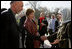 Afghan President Hamid Karzai introduces his wife, Dr. Karzai, to Laura Bush outside the presidential residence in Kabul, Afghanistan, Wednesday, March 30, 2005.