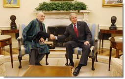 President George W. Bush meets with President Hamid Karzai of Afghanistan in the Oval Office Friday, Sept. 26, 2008, at the White House. White House photo by Eric Draper