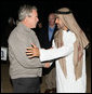 Crown Prince Sheikh Mohammed bin Zayed Al Nayhan and President George W. Bush embrace as they conclude their dinner in the desert Sunday, Jan. 13, 2008, near Abu Dhabi. President Bush will depart the United Arab Emirates Monday, continuing on to Saudi Arabia on the last leg of his Mideast visit. White House photo by Eric Draper