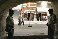 Jordanians guard the Haret Jdouna restaurant in Madaba, Jordan, as Laura Bush has lunch with Jordanian women leaders to discuss women.s rights Saturday, May 21, 2005.