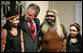 President George W. Bush hugs a young girl Thursday, Sept. 6, 2007, following a performance of Aboriginal song and dance at the Australian National Maritime Museum in Sydney. White House photo by Eric Draper