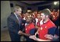 President George W. Bush visits with high school participants in the American Legion Boys and Girls Nation at the Dwight D. Eisenhowser Executive Office Building near the White House July 27, 2002. White House photo by Tina Hager.