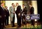 President George W. Bush shakes hands with Congressman Mike Oxley, R-OH, during the signing of the ceremony of the Sarbanes-Oxley Act in the East Room, July 30. "This new law sends very clear messages that all concerned must heed. This law says to every dishonest corporate leader: you will be exposed and punished; the era of low standards and false profits is over; no boardroom in America is above or beyond the law," said the President in his remarks. 