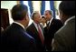 Before the signing ceremony of the Sarbanes-Oxley Act, President George W. Bush meets with Sen. Paul Sarbanes, D-Md., Secretary of Labor Elaine Chao and other dignitaries in the Blue Room at the White House July 30. 