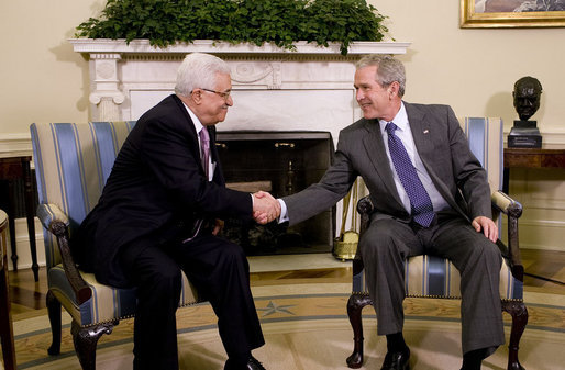 President George W. Bush and President Mahmoud Abbas exchange handshakes Thursday, Sept. 25, 2008, during their visit in the Oval Office of the White House. The leader of the Palestinian Authority thanked President Bush for his efforts to bring peace to the Mideast saying, "Mr. President, I would like to take the opportunity to thank you and thank the United States for the help and the support and the aid that you have given us, and as well as the efforts that you led to mobilize the world to help the Palestinian Authority on the economic front as well as on the security front. Mr. President, we will continue to work with you and we will continue to keep the hope alive in order to reach a political solution for our issue and for the Middle East." White House photo by Eric Draper