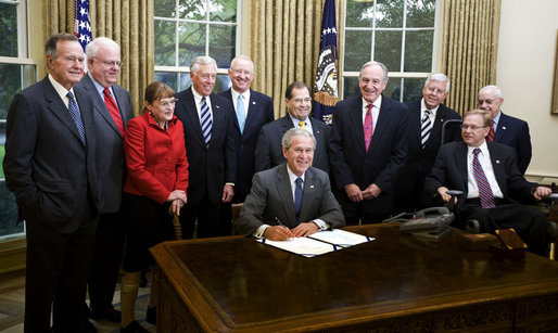 President George W. Bush signs the Americans with Disabilities Amendments Act Thursday, Sept. 25, 2008, in the Oval Office of the White House. Joining him for the signing of the law that amends the ADA Act of 1990, are, from left: Former President George H.W. Bush, Republican Rep. James Sensenbrenner of Wisconsin and his spouse, Cheryl Sensenbrenner; Democratic Rep. Steny Hoyer of Maryland; Republican Rep. Buck McKeon of California; Democratic Rep. Jerry Nadler of New York; Senator Tom Harkin (D-Iowa); Senator Mike Enzi (R-Wyo.); Democratic Rep. Jim Langevin of Rhode Island, and U.S. Attorney General Michael Mukasey. White House photo by Joyce N. Boghosian