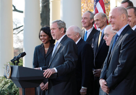 President George W. Bush, joined by Vice President Dick Cheney and members of his Cabinet, speaks with reporters in the Rose Garden, Friday, Dec. 14, 2007, where President Bush congratulated the Senate for passing a good energy bill, and urged Congress to move forward with spending legislation to fund the day to day operations of the federal government. President Bush also said he hoped those members of the press who attended a White House press reception Thursday evening had a good time, and joked that some silverware might be missing. White House photo by Eric Draper