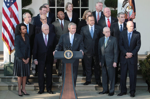 President George W. Bush, joined by Vice President Dick Cheney and members of his Cabinet, addresses reporters in the Rose Garden at the White House, Friday, Dec. 14, 2007, where President Bush congratulated the Senate for passing a good energy bill, and urged Congress to move forward with spending legislation to fund the day to day operations of the federal government. White House photo by Eric Draper