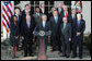 President George W. Bush, joined by Vice President Dick Cheney and members of his Cabinet, addresses reporters in the Rose Garden at the White House, Friday, Dec. 14, 2007, where President Bush congratulated the Senate for passing a good energy bill, and urged Congress to move forward with spending legislation to fund the day to day operations of the federal government. White House photo by Eric Draper