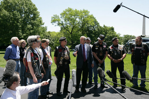President George W. Bush stands with National Executive Director of Rolling Thunder Artie Muller and other members as he gives a statement to the press about the importance of the work the motorcycle riders do on behalf of the military. White House photo by Chris Greenberg