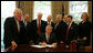 President George W. Bush signs H.R. 5715 into law Wednesday, May 7, 2008, during a ceremony in the Oval Office. The bill, "Ensuring Continued Access to Student Loans Act of 2008," is designed to provide continued availability of access to the Federal student loan program for students and families. Looking on are, from left: Senator Ted Kennedy, (D-MA); Congressman Ruben Hinojosa of Texas; Congressman George Miller of California; Congressman Buck McKeon of California; Senator Mike Enzi, (R-WY); Secretary of Treasury Hank Paulson; Congressman Ric Keller of Florida, and Secretary of Education Margaret Spellings. White House photo by Chris Greenberg