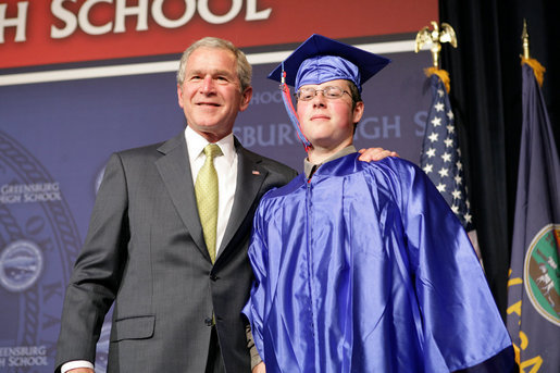 President George W. Bush shares a smile with Aaron Widner after presenting him with his diploma during commencement ceremonies for the Greensburg High School Class of 2008. Aaron has enlisted in the United States Marine Corps and will be attending Basic Training in the months to come. The town of Greensburg, KS was almost entirely destroyed when a tornado tore through the town one year ago today. White House photo by Chris Greenberg