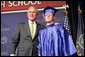 President George W. Bush shares a smile with Aaron Widner after presenting him with his diploma during commencement ceremonies for the Greensburg High School Class of 2008. Aaron has enlisted in the United States Marine Corps and will be attending Basic Training in the months to come. The town of Greensburg, KS was almost entirely destroyed when a tornado tore through the town one year ago today. White House photo by Chris Greenberg