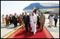 President George W. Bush and King Abdullah bin Abdulaziz walk with an entourage of greeters Friday, May 16, 2008, after the President’s arrival at Riyadh-King Khaled International Airport in Riyadh. White House photo by Joyce N. Boghosian