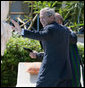 President George W. Bush waves as he walks with Afghanistan President Hamid Karzai Saturday, May 17, 2008, following their meeting with members of the media in Sharm el Sheikh, Egypt. White House photo by Chris Greenberg