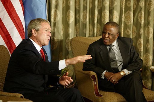 President George W. Bush begins participation in meeting with the President Festus Magae of Botswana in Gaborone, Botswana, Thursday, July 10, 2003. “We're thrilled to be here. You have been a very strong leader,” said President Bush during their joint press conference. “First, I want to commend you for your leadership. I appreciate your commitment to democracy and freedom, to rule of law and transparency. I want to congratulate you for serving your country so very well.”.