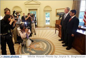 President George W. Bush stands with Sameer Mishra, 14, of Lafayette, Ind., during his visit Wednesday, Aug. 13, 2008, to the Oval Office of the White House. The teen was named the 2008 Scripps National Spelling Bee Champion in the 16th round after correctly spelling the word 