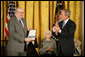 Robert Hyde accepts the Presidential Medal of Freedom from President George W. Bush on behalf of his father U.S. Representative Henry Hyde, R-Ill., during a ceremony Monday, Nov. 5, 2007, in the East Room. "Colleagues were struck by his extraordinary intellect, his deep convictions, and eloquent voice," said the President. "In committee and in the House chamber, the background noise would stop when Henry Hyde had the floor." White House photo by Eric Draper