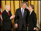 President George W. Bush congratulates C-SPAN founder Brian Lamb and his wife Victoria during the presentation of the Presidential Medal of Freedom Monday, Nov. 5, 2007, in the East Room. "For nearly 30 years, the proceedings of the House of Representatives have been televised -- unfiltered, uninterrupted, unedited, and live," said the President. "For this we can thank the Cable-Satellite Public Affairs Network, or C-SPAN. And for C-SPAN, we can thank a visionary American named Brian Lamb." White House photo by Eric Draper
