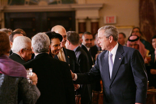 President George W. Bush speaks with U.S. Secretary of State Condoleezza Rice, center, joined by Palestinian President Mahmoud Abbas, left, and Israeli Prime Minister Ehud Olmert, following President Bush’s address at the Secretary of State’s Dinner Monday evening, Nov. 26, 2007 at the State Department in Washington, D.C., welcoming the participants attending the Annapolis Conference. White House photo by Chris Greenberg