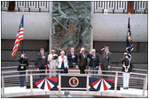 President George W. Bush joins fellow veterans in standing at attention during the playing of the National Anthem at the dedication of the National D-Day Memorial in Bedford, Va., June 6, 2001. The memorial was built to honor those who served and died during Operation Overlord in the D-Day invasion at Normandy, France, June 6, 1944.