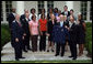 President George W. Bush stands with members of the Auburn University Women's Outdoor Track and Field 2006 Championship Team Monday, June 18, 2007 at the White House, during a photo opportunity with the 2006 and 2007 NCAA Sports Champions. White House photo by Chris Greenberg