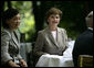 Mrs. Laura Bush sits with Mrs. Akie Abe during coffee Thursday, June 7, 2007, in the Castle Garden at Burg Schlitz in Hohen Demzin, Germany. White House photo by Shealah Craighead